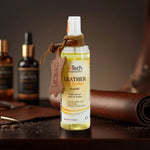 Leather care product with applicator on a leather surface, surrounded by leather care bottles.